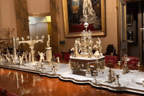 Ornate silver-gilt Wellington Shield centrepiece displayed in Apsley House dining room.