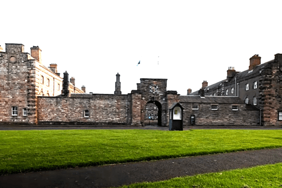 Historic red-sandstone barracks of Berwick Barracks in Northumberland, with a central arched gateway and large parade ground.