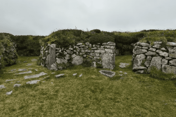 Stone-built entrance and walls of Chysauster Ancient Village in Cornwall.