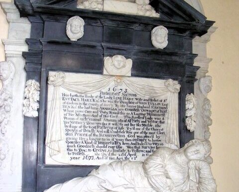 Elaborate marble tomb inside the De Grey Mausoleum, featuring a reclining effigy beneath a carved architectural surround.
