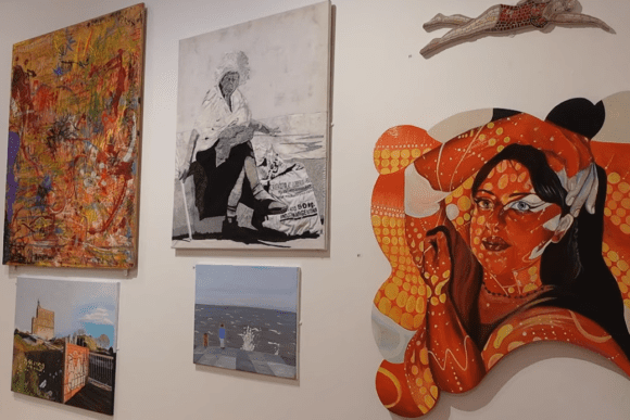 Contemporary art exhibition at Ferens Art Gallery in Hull, featuring colourful mixed-media paintings, portrait artwork, abstract compositions, and modern creative displays on a gallery wall.