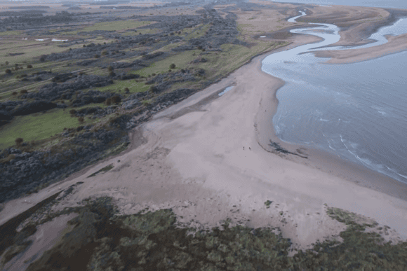 Aerial view of Gibraltar Point National Nature Reserve in Lincolnshire, showcasing sweeping sandbanks, winding tidal channels, salt marshes, and unspoilt coastal landscapes along the North Sea.