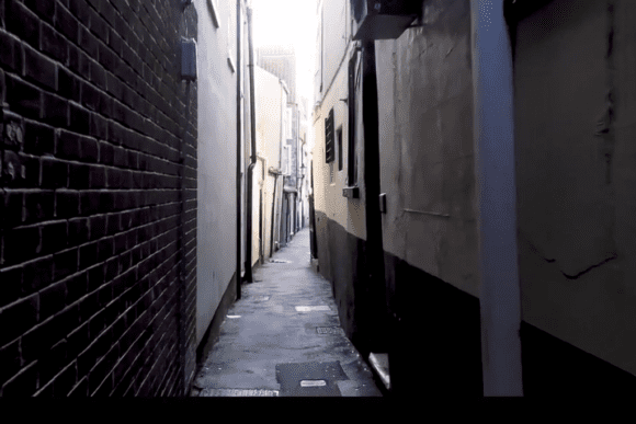 Narrow historic alleyway between tall buildings in Great Yarmouth, showing the tight passage typical of the town’s row houses.
