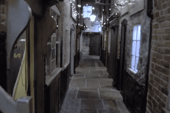 Ruins of Greyfriars’ Cloisters in Great Yarmouth with weathered brick arches and sunlight streaming through the historic structure.