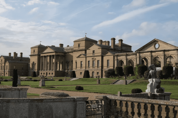 Holkham Hall, a grand Palladian country house with columns and landscaped gardens in Norfolk.