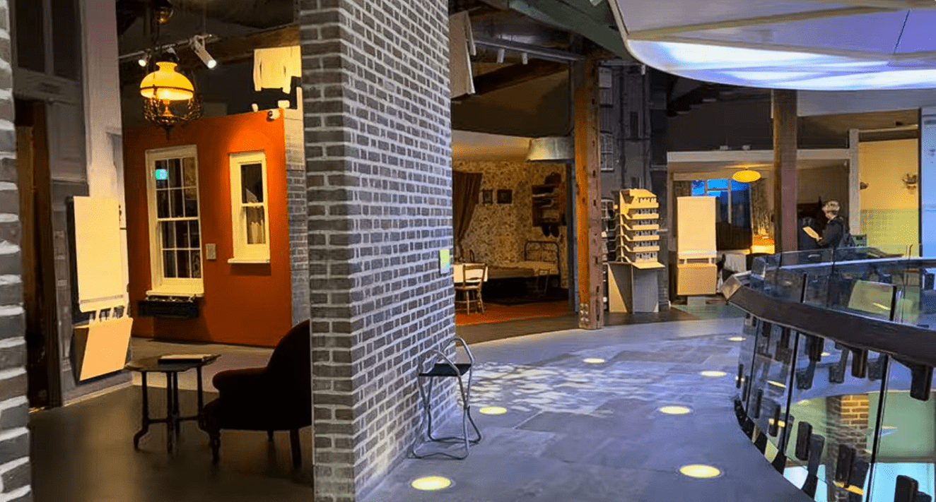 Interactive exhibition space inside the Museum of the Home in London, featuring recreated domestic interiors, period home displays, historical furnishings, and immersive exhibits exploring everyday life through the centuries.