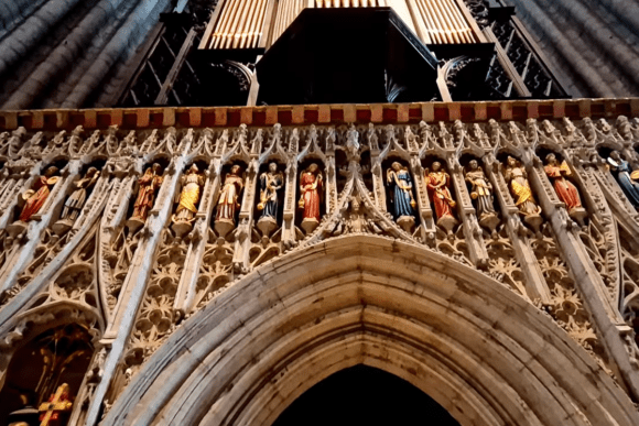 Detailed stone carvings and statues inside Ripon Cathedral in North Yorkshire, England, featuring ornate Gothic architecture and religious figures.