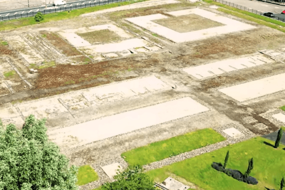 Aerial view of Segedunum Roman Fort ruins showing foundation outlines of barracks and buildings at the eastern end of Hadrian’s Wall, North Tyneside.