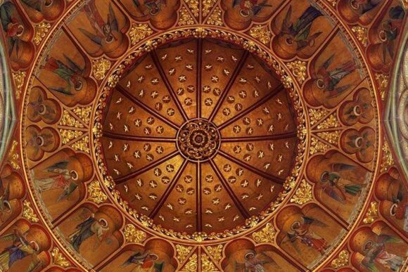 St Mary’s Church Studley Royal ornate painted dome ceiling with angels, gold detailing, and Gothic Revival interior artwork.