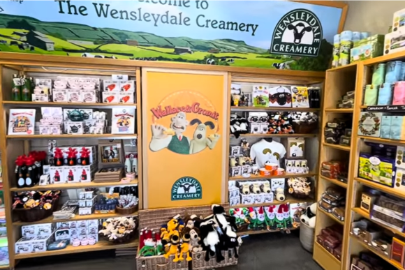 Gift shop at Wensleydale Creamery Visitor Centre featuring Wallace and Gromit merchandise, souvenirs, gifts, and Wensleydale Creamery products in Yorkshire.