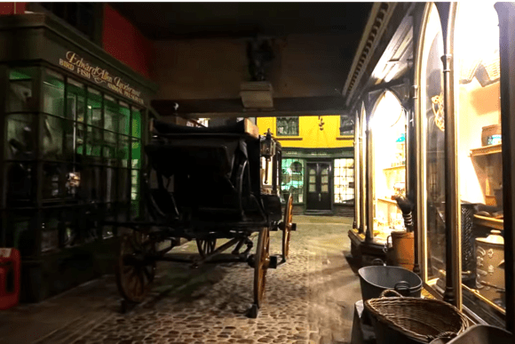 Kirkgate recreated Victorian street inside York Castle Museum featuring historic shopfronts, a horse-drawn carriage, cobbled streets, and authentic 19th-century retail displays.
