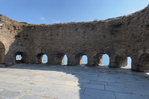 Row of arched gun ports inside the stone battery at Dartmouth Castle overlooking the River Dart.