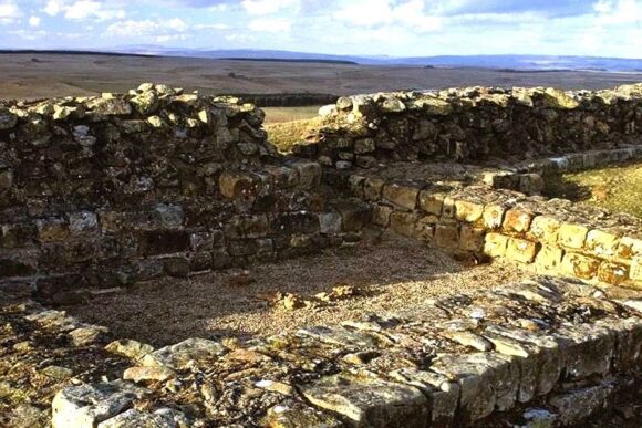 Stone ruins of Sewingshields Wall along Hadrian’s Wall with open moorland landscape in Northumberland National Park.