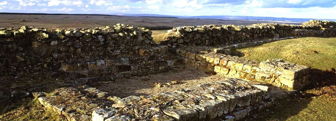 Stone ruins of Sewingshields Wall along Hadrian’s Wall with open moorland landscape in Northumberland National Park.